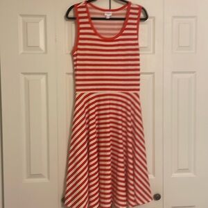 Lula Roe cotton, red-striped dress has a fun pattern. It has only been worn once